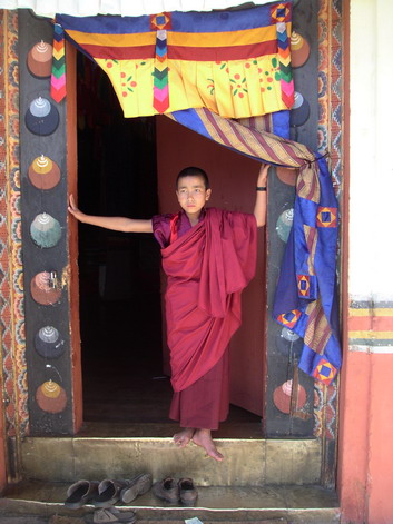 Young monk in doorway